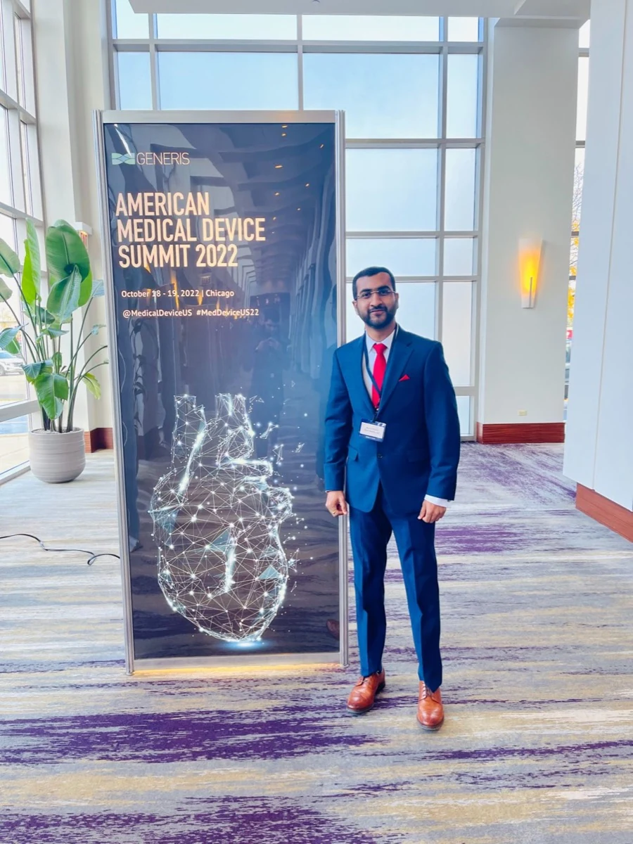 Vamsi Reddy at the American Medical Device Summit 2022 banner